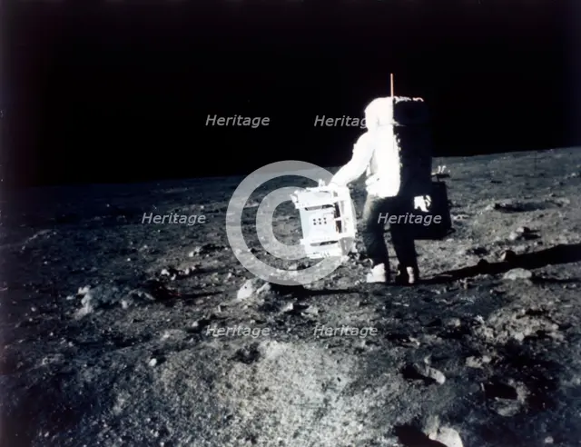 Buzz Aldrin carries out an experiment on the lunar surface, Apollo II mission, July 1969. Creator: Neil Armstrong.