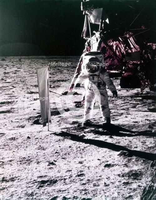 Buzz Aldrin deploys solar wind collector on the surface of the Moon, Apollo 11 mission, July 1969.  Creator: Neil Armstrong.
