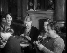 Buckingham Palace Hosting a Sewing Group. Large Numbers of Women Sewing or Knitting, 1940. Creator: British Pathe Ltd
