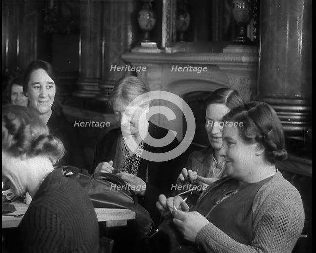 Buckingham Palace Hosting a Sewing Group. Large Numbers of Women Sewing or Knitting, 1940. Creator: British Pathe Ltd.