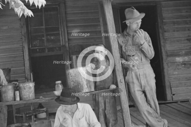 Bud Fields, Tengle boy, and Floyd Burroughs on Frank Tengle's porch, Hale County, Alabama, 1936. Creator: Walker Evans.