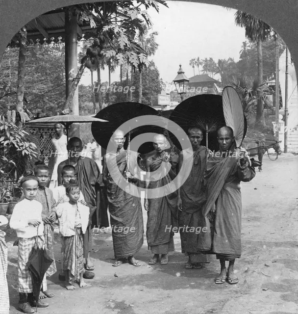 Buddhist monks with sunshades and fans, Rangoon, Burma, 1908. Artist: Stereo Travel Co