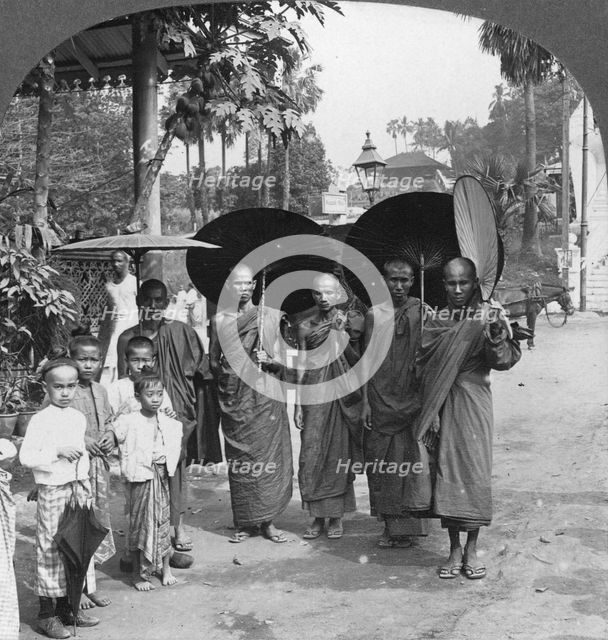Buddhist monks with sunshades and fans, Rangoon, Burma, 1908. Artist: Stereo Travel Co