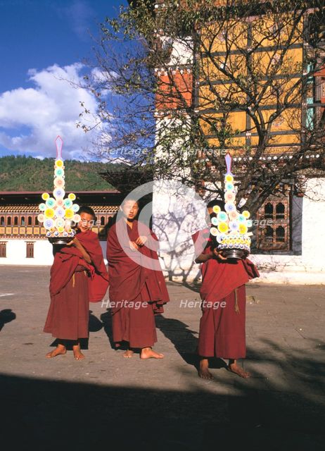 Buddhist monks, Tashichho Dzong, Thimphu, Bhutan. Creator: Vivienne Sharp.