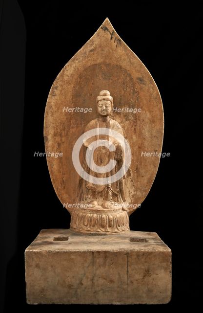 Buddhist tablet: standing figure in high relief; right hand missing, Period of Division, 551 CE. Creator: Unknown.