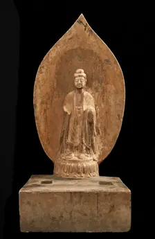 Buddhist tablet: standing figure in high relief; right hand missing, Period of Division, 551 CE. Creator: Unknown