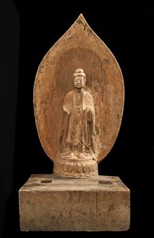 Buddhist tablet: standing figure in high relief; right hand missing, Period of Division, 551 CE. Creator: Unknown