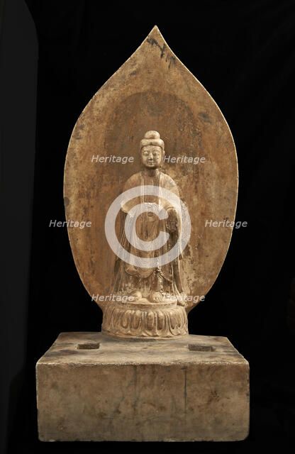 Buddhist tablet: standing figure in high relief; right hand missing, Period of Division, 551 CE. Creator: Unknown.