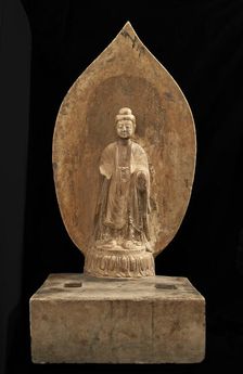 Buddhist tablet: standing figure in high relief; right hand missing, Period of Division, 551 CE. Creator: Unknown