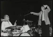 Buddy Rich and conductor Andrew Litton, Royal Festival Hall, London, June 1985. Creator: Denis Williams