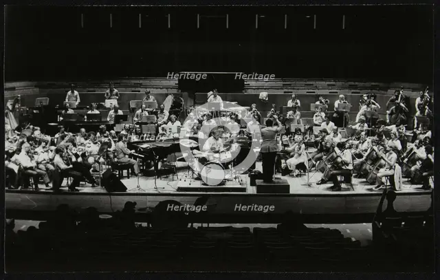 Buddy Rich and the Royal Philharmonic Orchestra in concert at the Royal Festival Hall, London, 1985. Creator: Denis Williams.