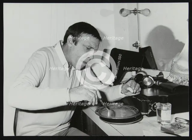 Buddy Rich eating backstage at Ronnie Scott's Jazz Club, London, 1979. Creator: Denis Williams.