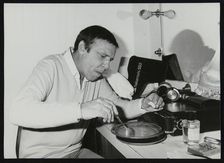 Buddy Rich eating backstage at Ronnie Scott's Jazz Club, London, 1979. Artist: Denis Williams