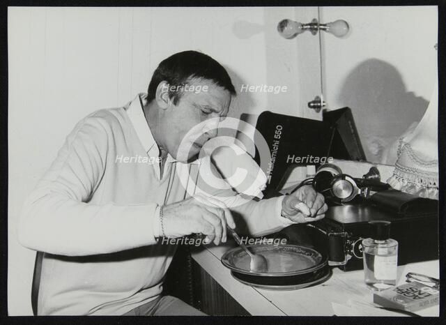Buddy Rich eating backstage at Ronnie Scott's Jazz Club, London, 1979. Artist: Denis Williams