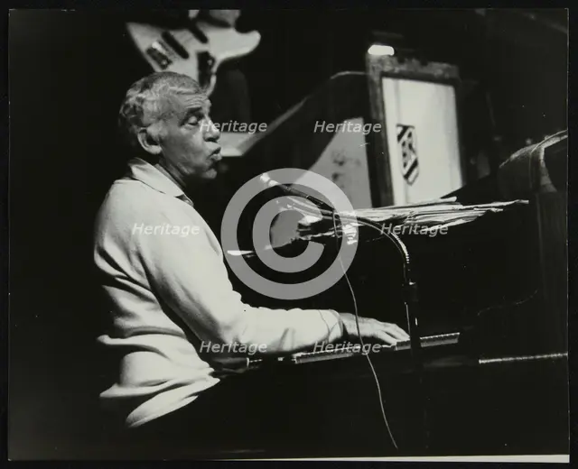 Buddy Rich playing the piano, Forum Theatre, Hatfield, Hertfordshire, November 1986. Creator: Denis Williams.
