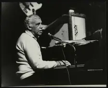 Buddy Rich playing the piano, Forum Theatre, Hatfield, Hertfordshire, November 1986. Creator: Denis Williams