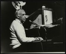Buddy Rich playing the piano, Forum Theatre, Hatfield, Hertfordshire, November 1986. Creator: Denis Williams