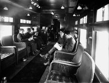Buffet library car on a deluxe overland limited train, between 1910 and 1920. Creator: Unknown