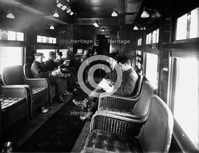 Buffet library car on a deluxe overland limited train, between 1910 and 1920. Creator: Unknown.