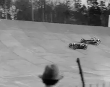 Bugatti Type 35 of EM Thomas and Ballot of Jack Dunfee racing at a BARC meeting, Brooklands, 1930. Artist: Bill Brunell