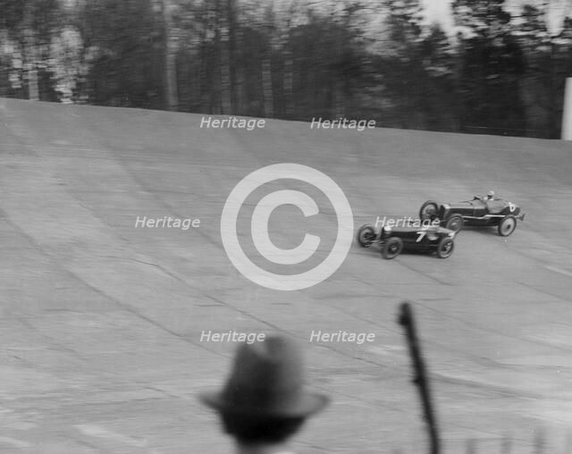 Bugatti Type 35 of EM Thomas and Ballot of Jack Dunfee racing at a BARC meeting, Brooklands, 1930. Artist: Bill Brunell.