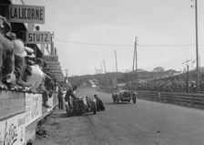 Bugatti Type 35 passing a Lombard in the pits at the Boulogne Motor Week, France, 1928. Artist: Bill Brunell