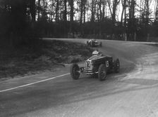 Bugatti Type 35B of Jock Leith leading a Riley Brooklands at Donington Park, Leicestershire, 1935. Artist: Bill Brunell