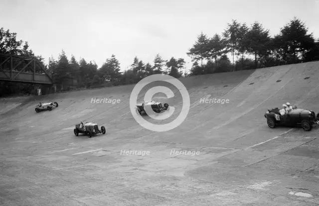 Bugatti Type 43, Sunbeam and Invicta racing on the Members Banking at Brooklands. Artist: Bill Brunell.