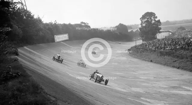 Bugatti Type 54 leading a Talbot 90 on the banking at Brooklands, 1930s. Artist: Bill Brunell.