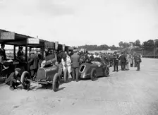 Bugatti Special 1 and Gwynne Special in the pits at a BARC meeting, Brooklands, 1933. Artist: Bill Brunell