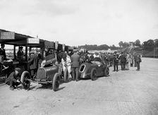Bugatti Special 1 and Gwynne Special in the pits at a BARC meeting, Brooklands, 1933. Artist: Bill Brunell