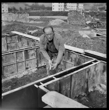 Builder working on the Penhill Estate, Swindon, Wiltshire, 1955. Creator: Unknown