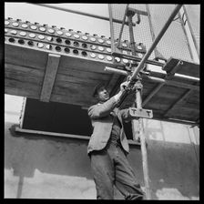 Builder working on the Penhill Estate, Swindon, Wiltshire, 1955. Creator: Unknown