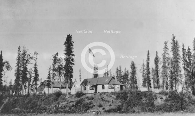 Building with American flag raised, between c1900 and 1916. Creator: Unknown.