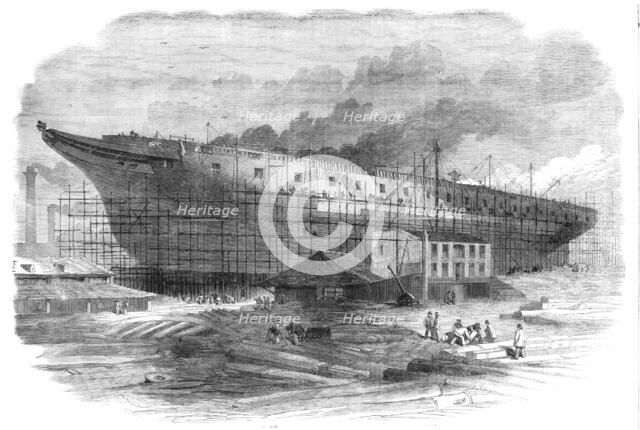 Building the great steam-frigate "Warrior" at the Thames Ironworks, Blackwall, 1860. Creator: Smyth.