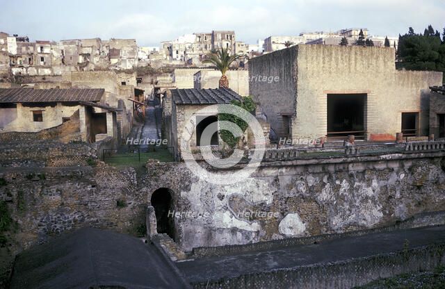 Buildings of Herculaneum with houses of the modern town of Ercolano above, Italy. Artist: Unknown