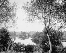 Buildings by river, probably the Huron River, Ypsilanti, Michigan, between 1900 and 1910. Creator: Unknown