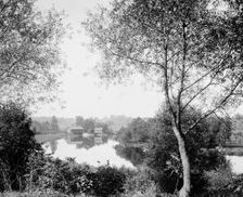 Buildings by river, probably the Huron River, Ypsilanti, Michigan, between 1900 and 1910. Creator: Unknown