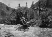 Bullchief at the ford, c1905. Creator: Edward Sheriff Curtis