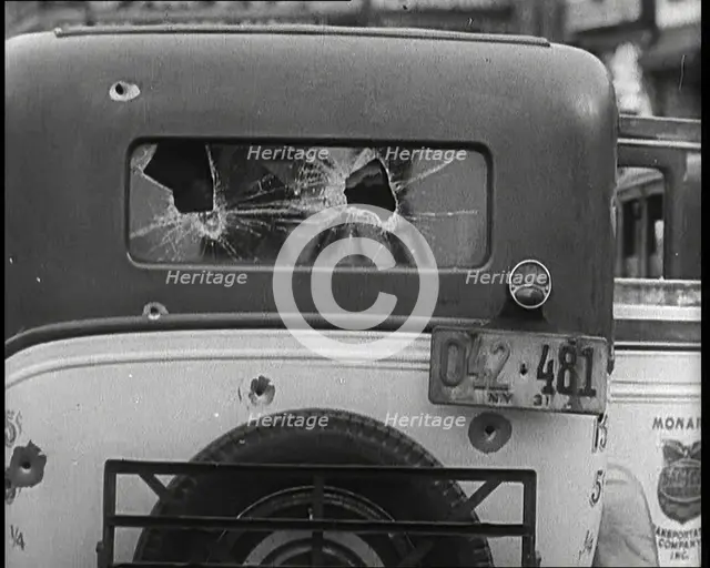Bullet Holes Through the Back Window of a Car, 1932. Creator: British Pathe Ltd.