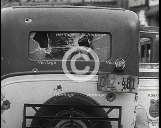 Bullet Holes Through the Back Window of a Car, 1932. Creator: British Pathe Ltd.