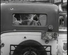 Bullet Holes Through the Back Window of a Car, 1932. Creator: British Pathe Ltd