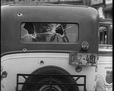 Bullet Holes Through the Back Window of a Car, 1932. Creator: British Pathe Ltd