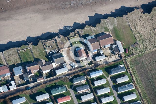 Bungalows at risk from coastal erosion, Green Lane, near Skipsea, East Riding of Yorkshire, 2014. Creator: Historic England Staff Photographer.
