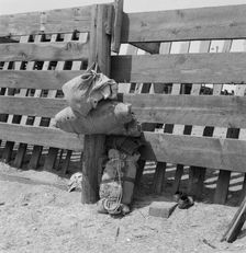 Bundles against cattle corrals by the railroad..., Washington, Yakima Valley, near Toppenish, 1939. Creator: Dorothea Lange