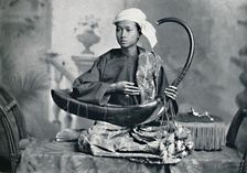 Burmese harp player, 1902