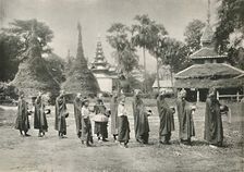 Burmese Phoongyies Collecting Alms 1900. Creator: Unknown