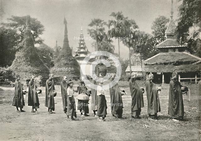 'Burmese Phoongyies Collecting Alms', 1900. Creator: Unknown.