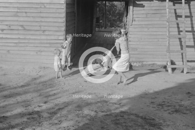 Burroughs children playing in the yard, Hale County, Alabama, 1936. Creator: Walker Evans.