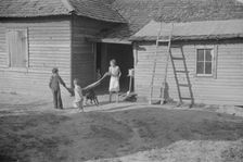 Burroughs children playing in the yard, Hale County, Alabama, 1936. Creator: Walker Evans